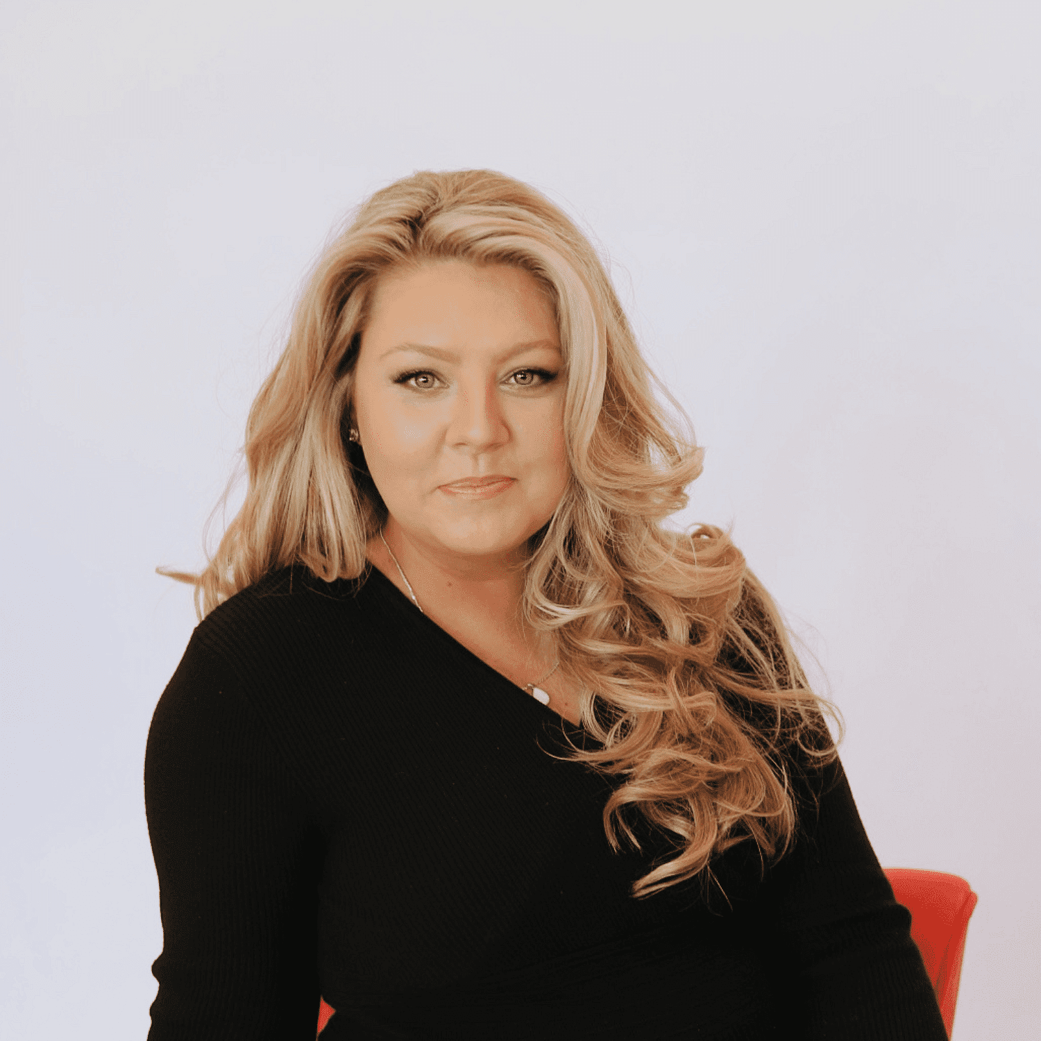 Portrait of April, a professional stylist at Shairon's Salon, showcasing their expertise and style.
