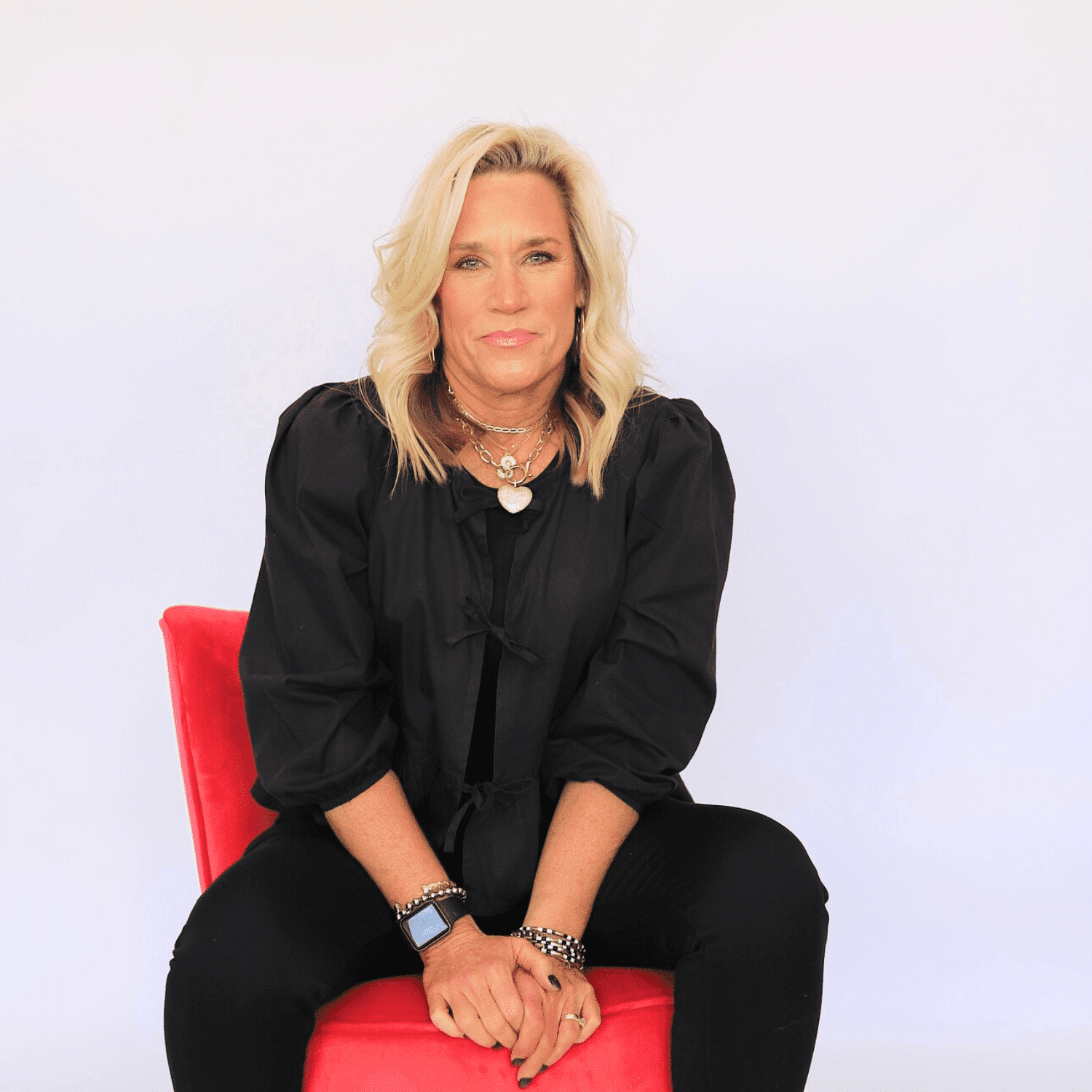 Portrait of Sharon, a professional stylist at Shairon's Salon, showcasing their expertise and style.